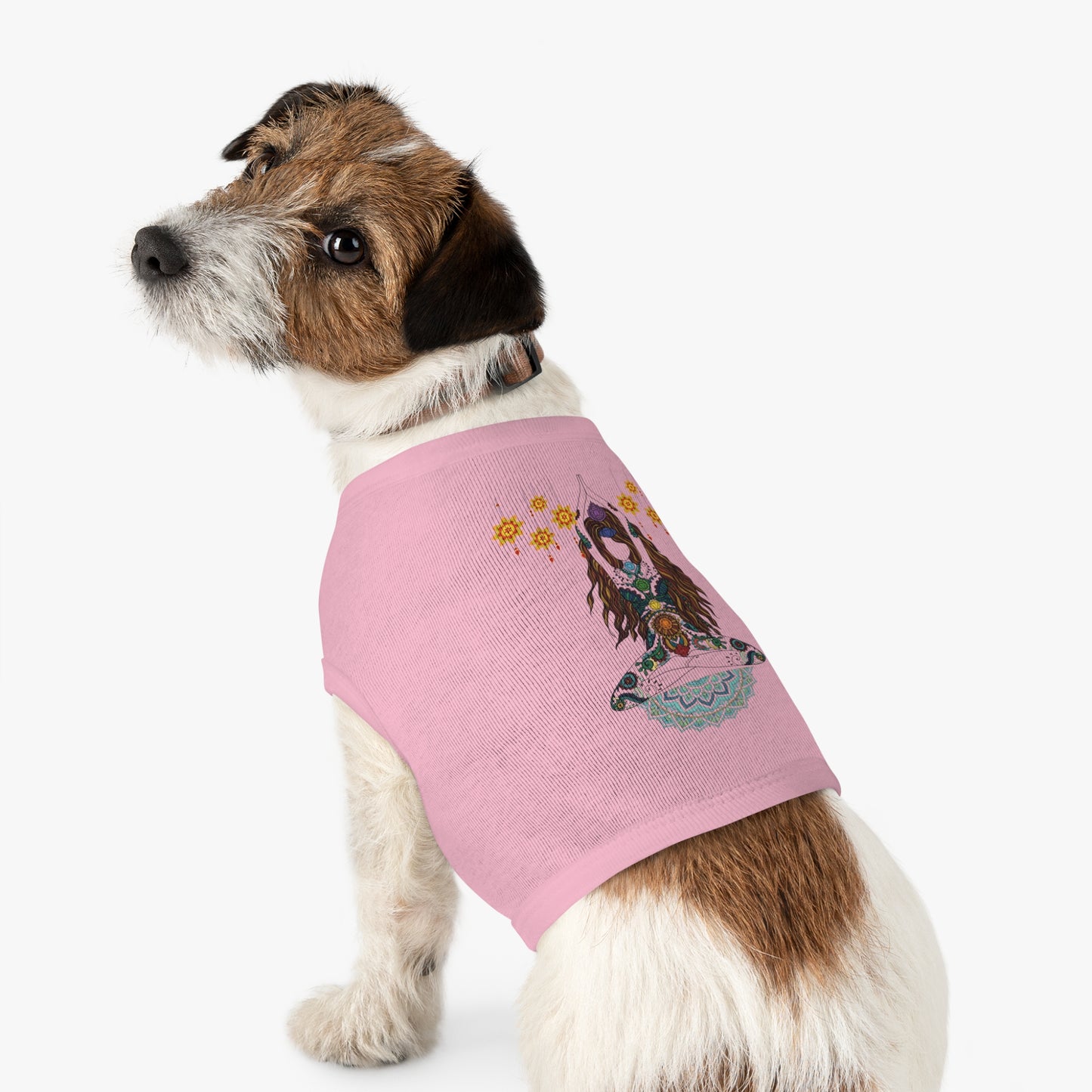Dog wearing a pink sweater with a printed design on a white background