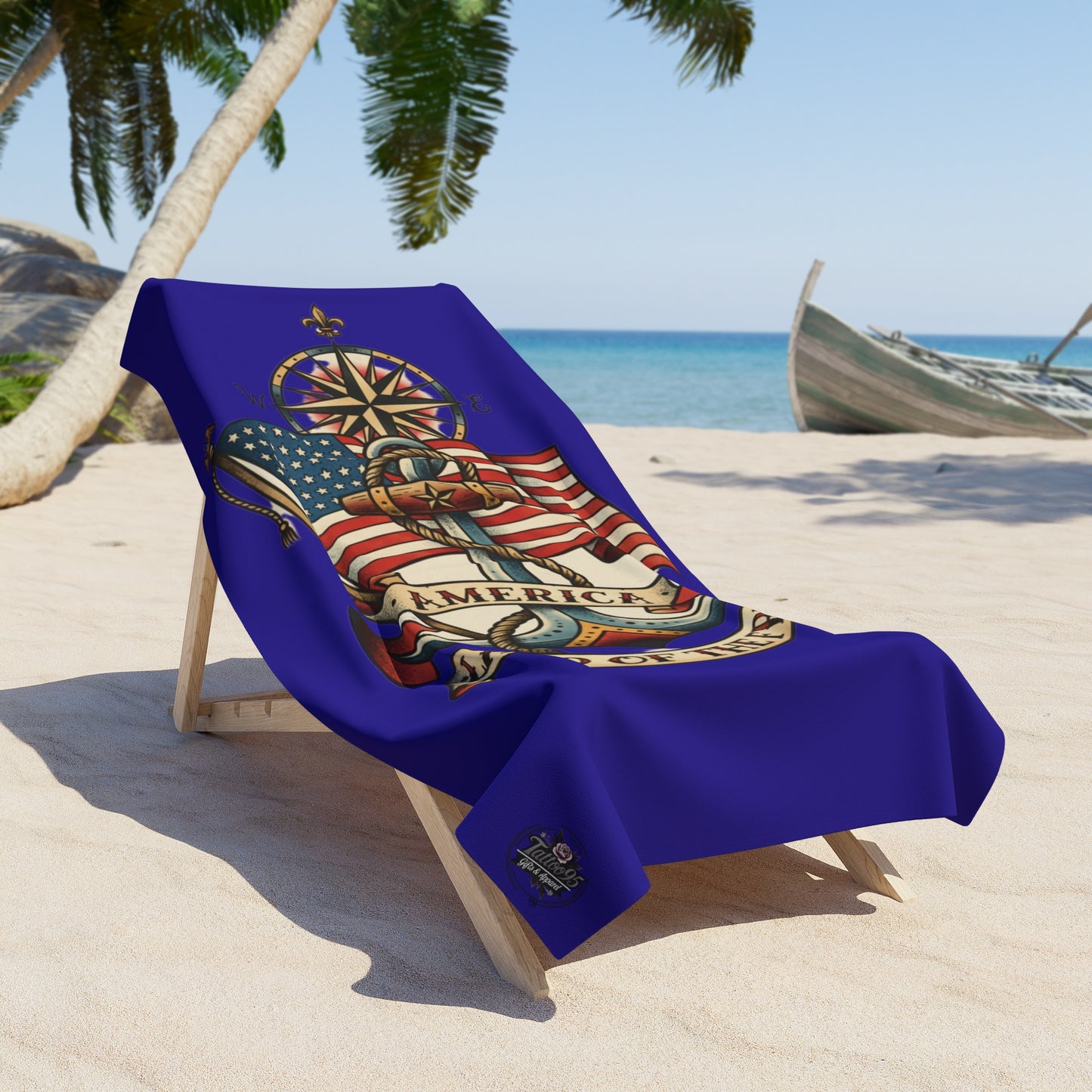 Beach towel with colorful anchor design on a lounge chair by the ocean