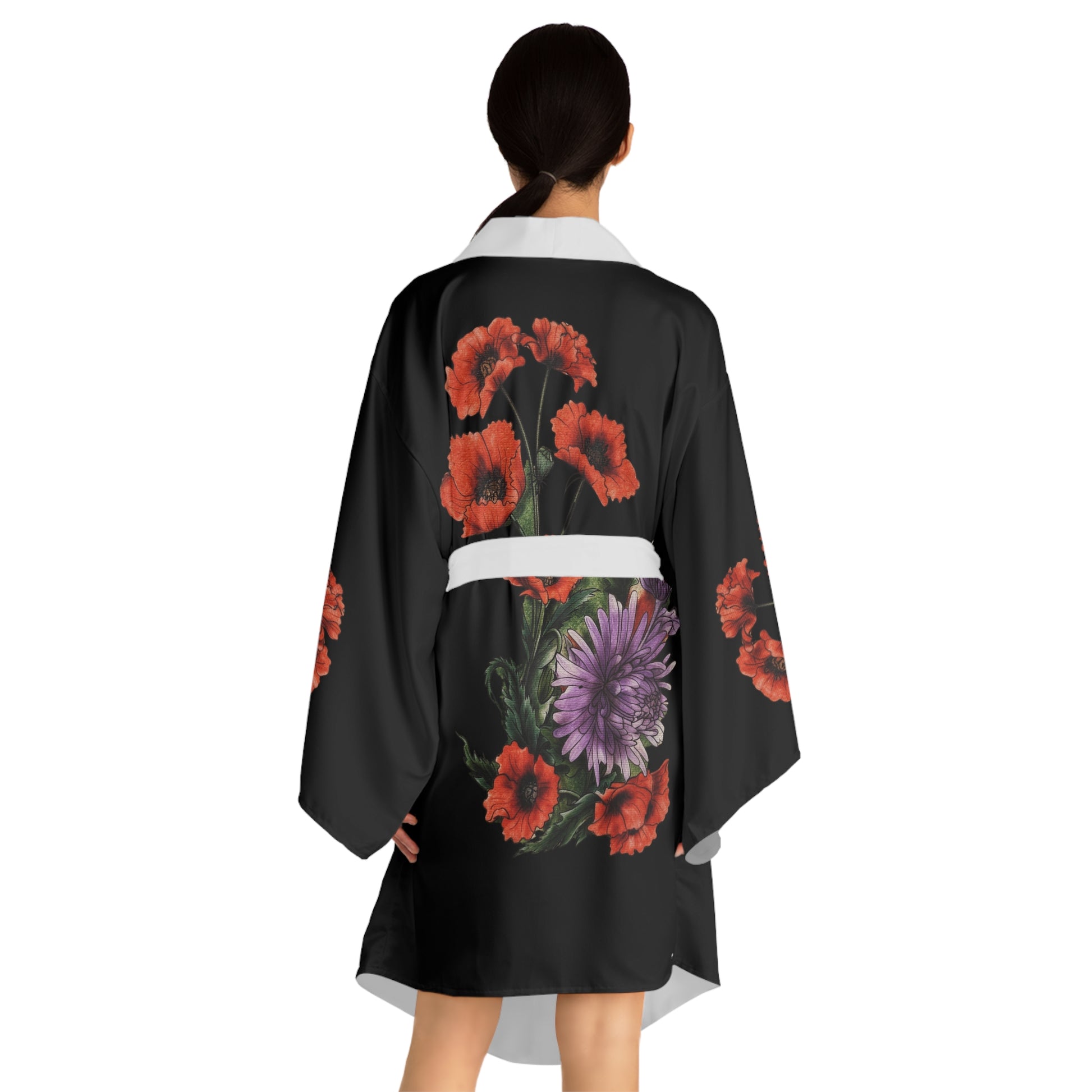 Black kimono with floral designs on a white background