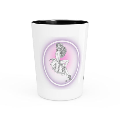 White shot glass with black interior, featuring a graphic of a woman sitting on a cloud with a purple halo.