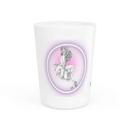 White shot glass with a decorative design of a woman on a pink background